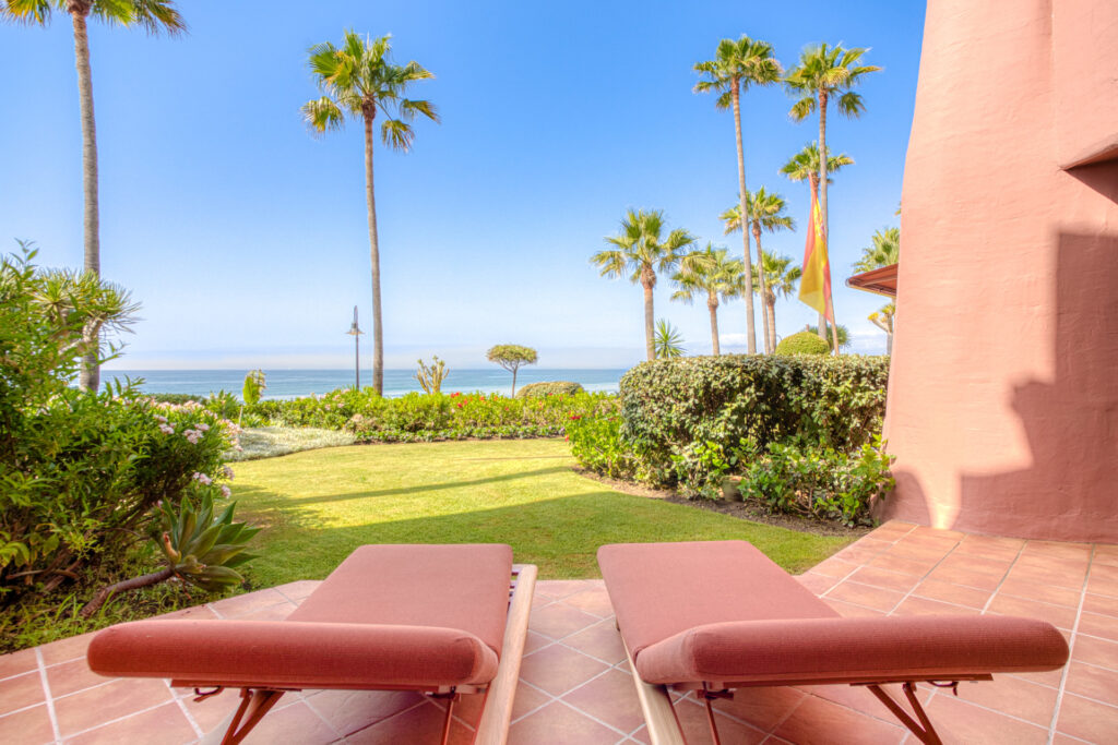 Impeccably renovated, south facing beach front, garden apartment located in the exclusive Menara Beach community on the sought-after New Golden Mile